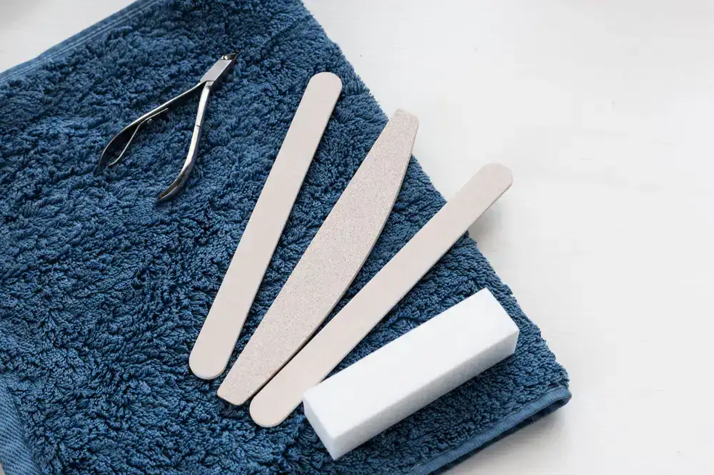 A neat setup of manicure tools and fresh towels on a home table